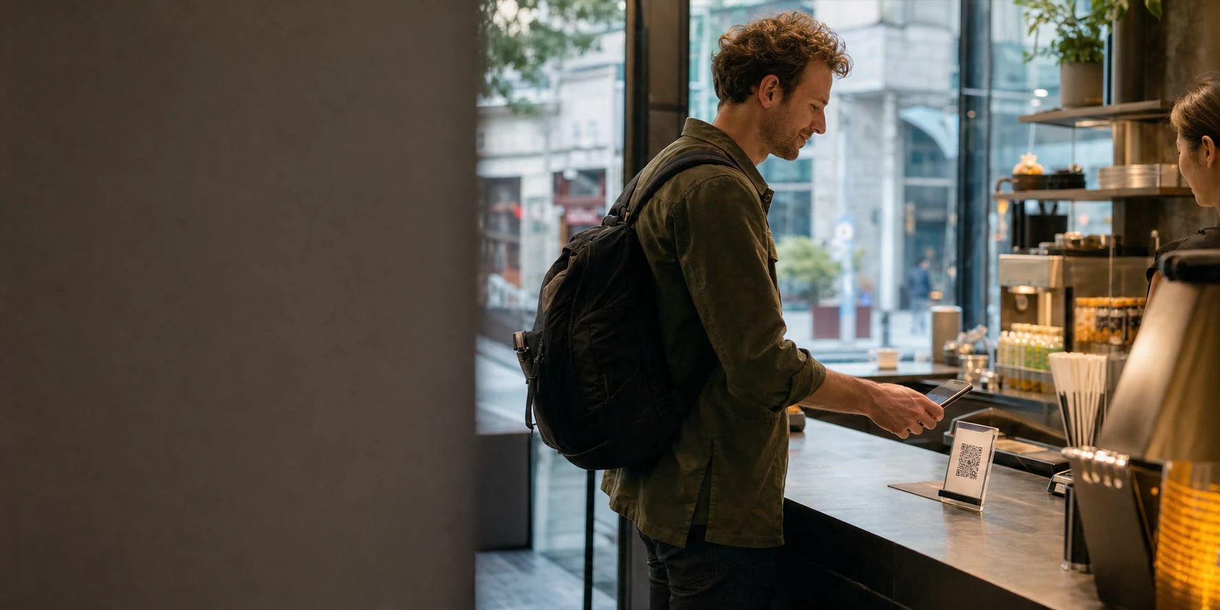 An international traveler paying by phone at a Shanghai counter