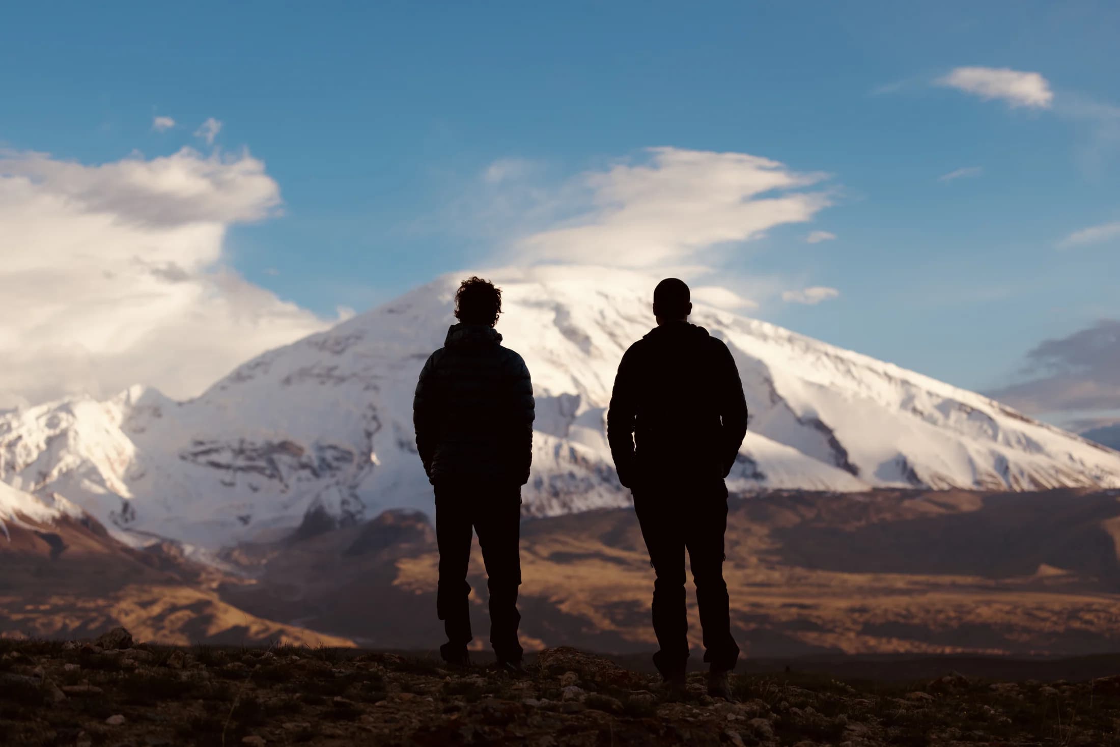Travellers watching the Pamir road corridor at dusk